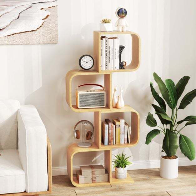 S-shaped bamboo bookcase with books and ornaments in a living room