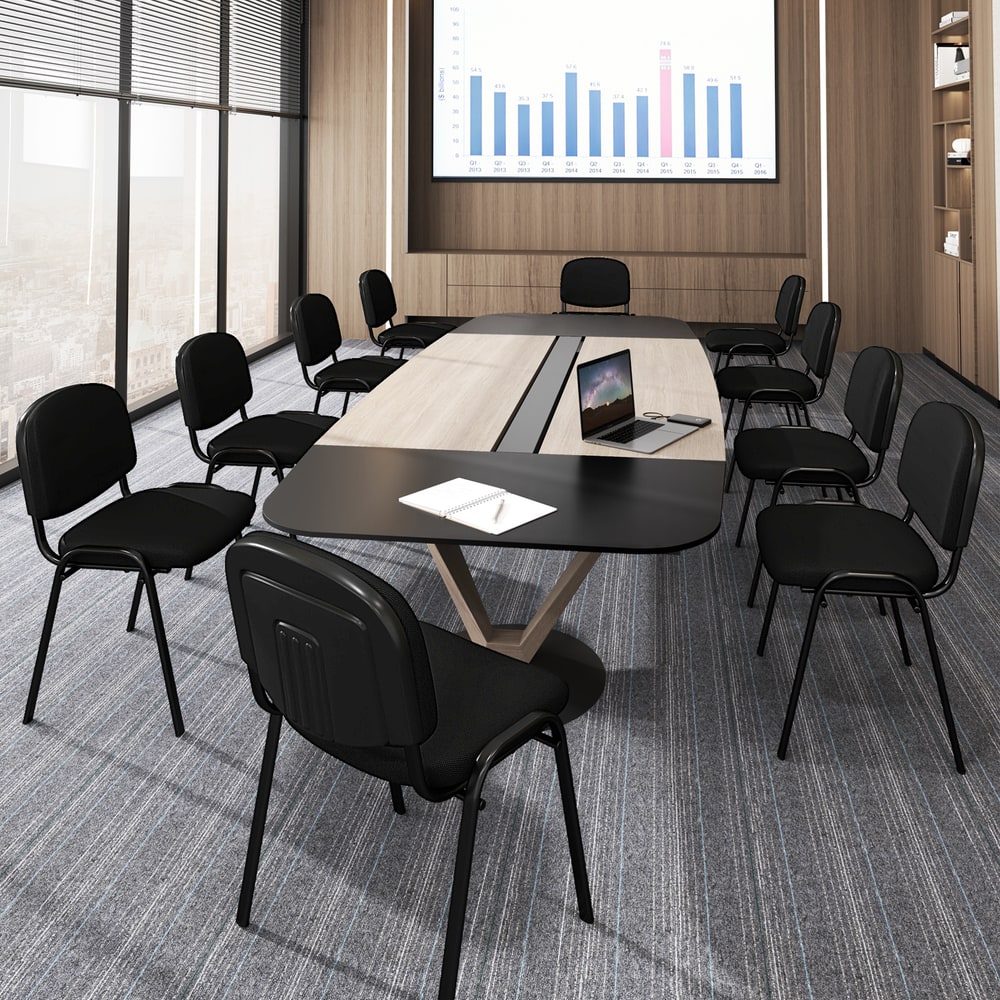 The guest chairs positioned around a large wooden conference table in a professional meeting room