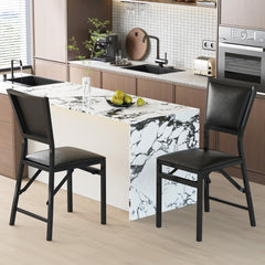 Four steel folding chairs in a modern kitchen setting