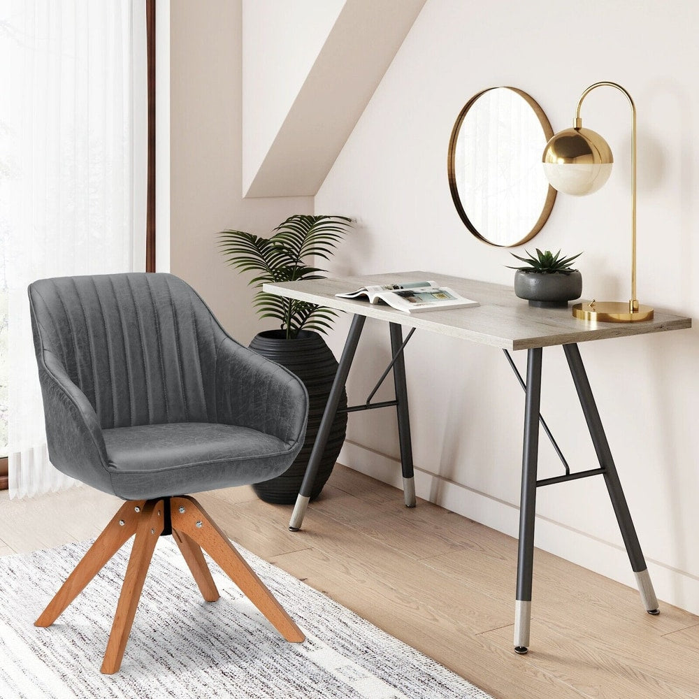 A grey fabric dining chair with wooden legs next to a desk