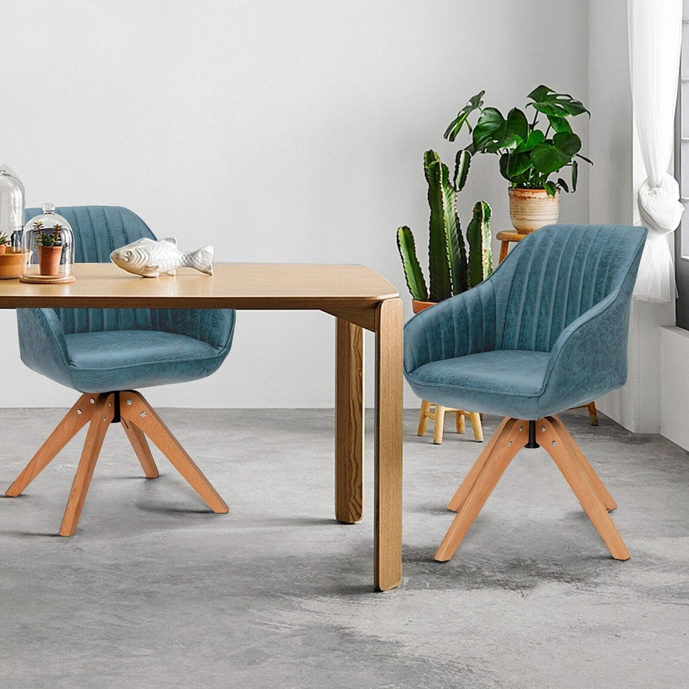 Two blue swivel accent chairs at a dining table