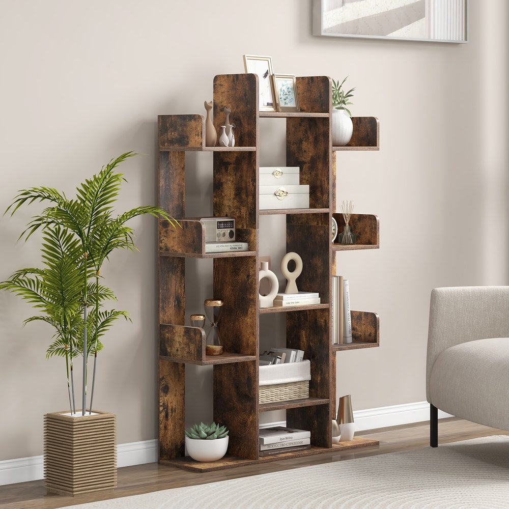 Rustic brown tree bookshelf in a living room next to a sofa and plant