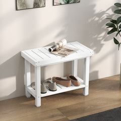 The shower stool used as a hallway shoe rack with a magazine resting on the slatted top surface