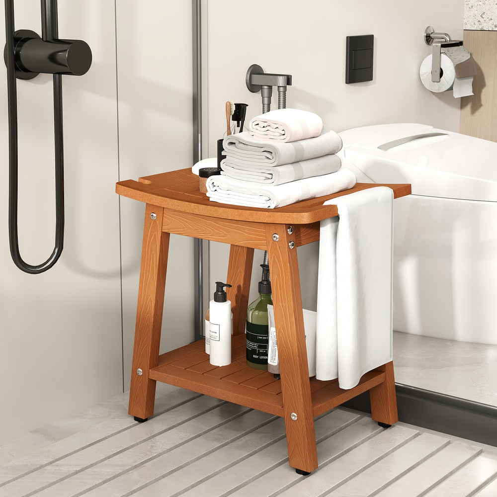 The shower stool placed inside a modern bathroom shower area with stacked towels and toiletries