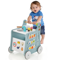Baby boy pushing the blue wooden baby stroller push and pull learning activity center