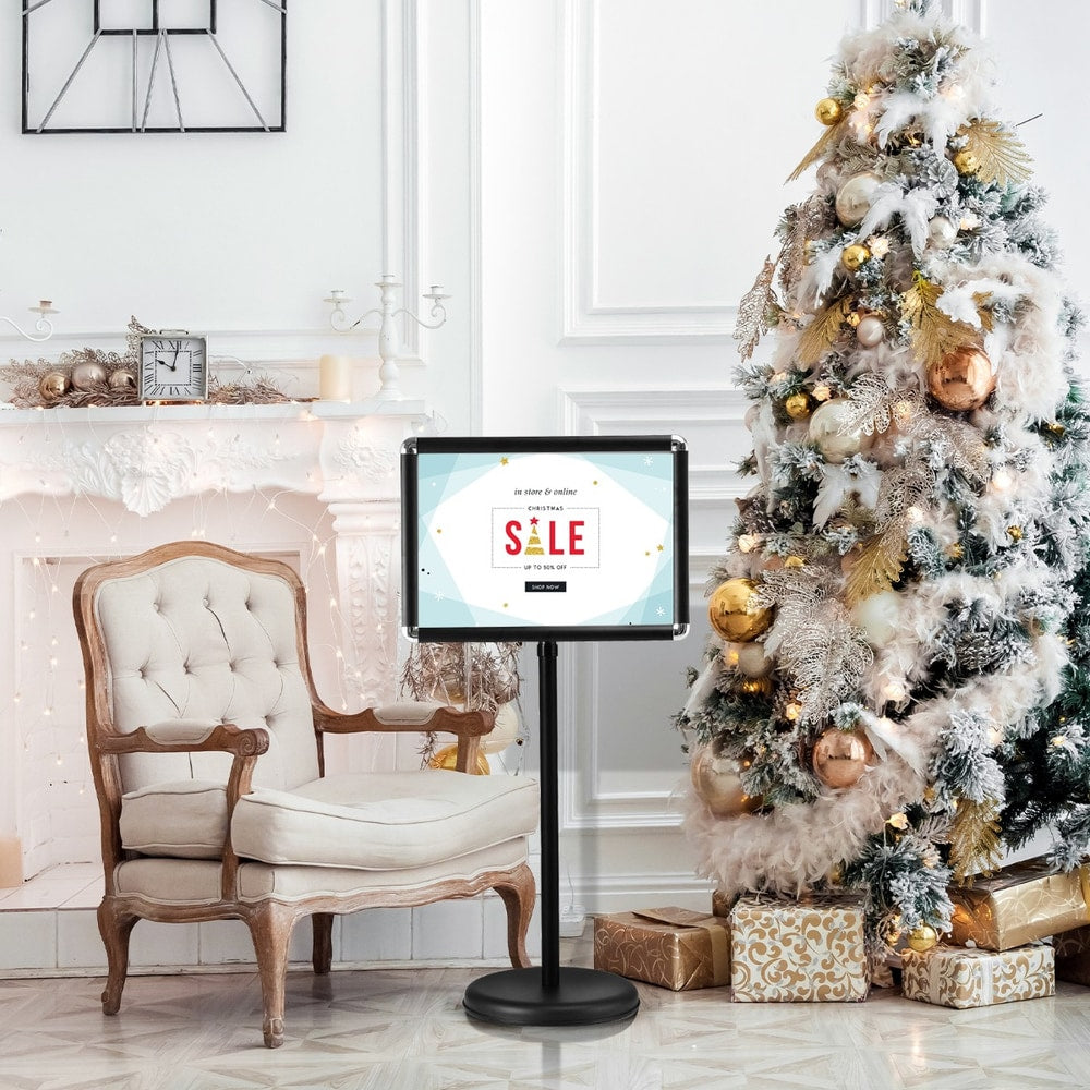 The presentation supplies stand displaying a Christmas sale sign in a festive living room