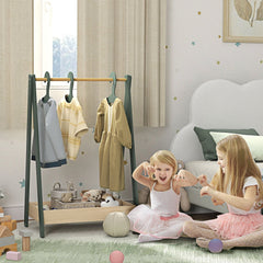 The green kids clothes rail in a nursery with two young girls playing around it