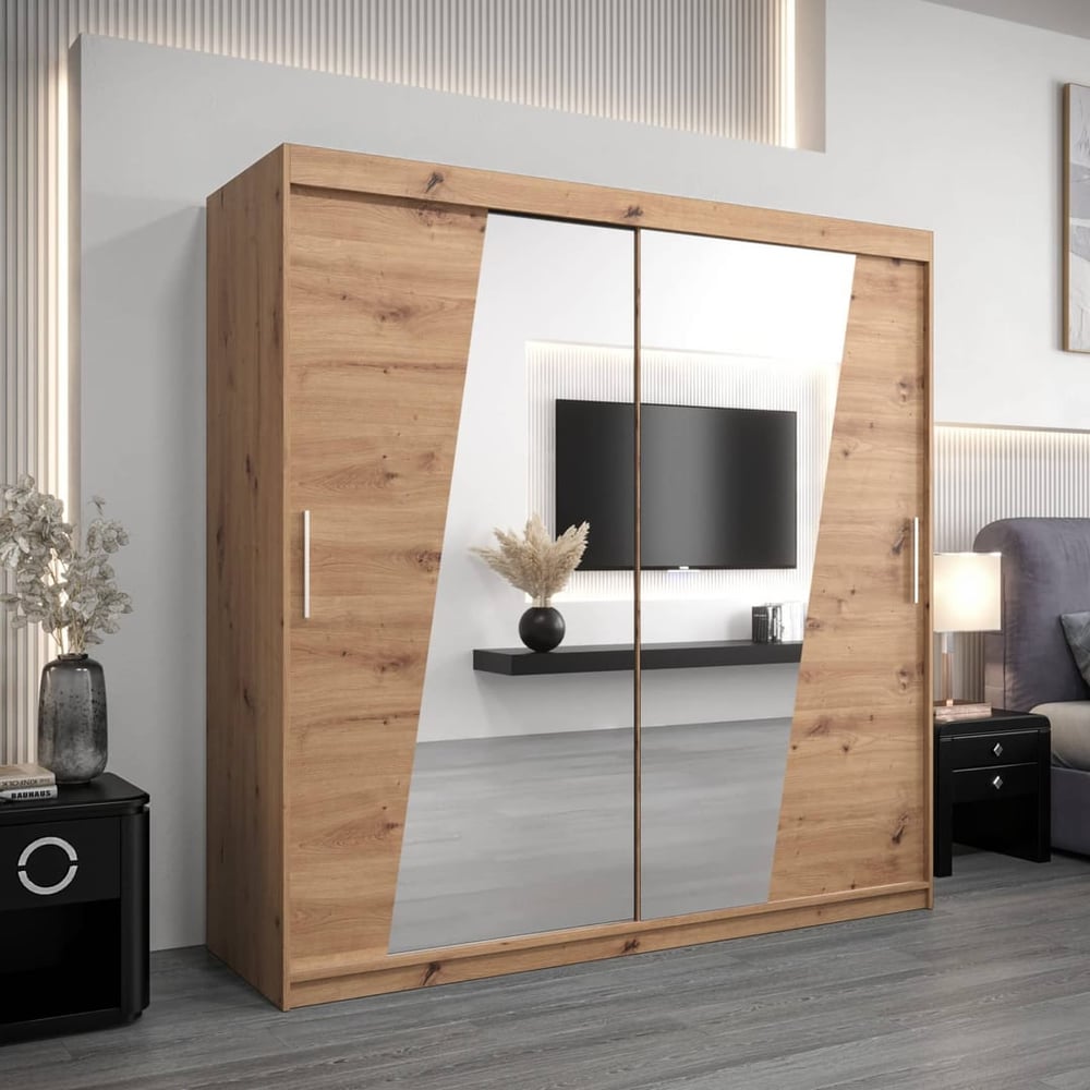 The sliding door wardrobe in oak effect with mirrored panels in a modern bedroom setting