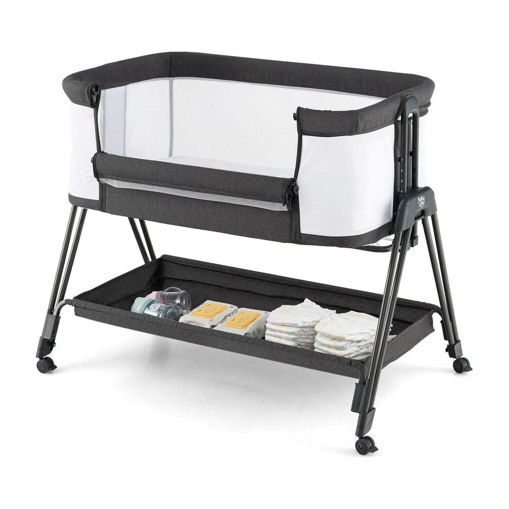 Baby Bedside Crib with Mattress for Birth to 9kg, a grey bedside sleeper with a storage shelf underneath and wheels