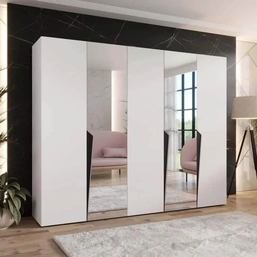 A white hinged wardrobe with mirrored doors in a minimalist room