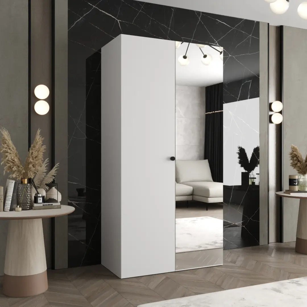 The hinged wardrobe in a white finish with a mirrored door