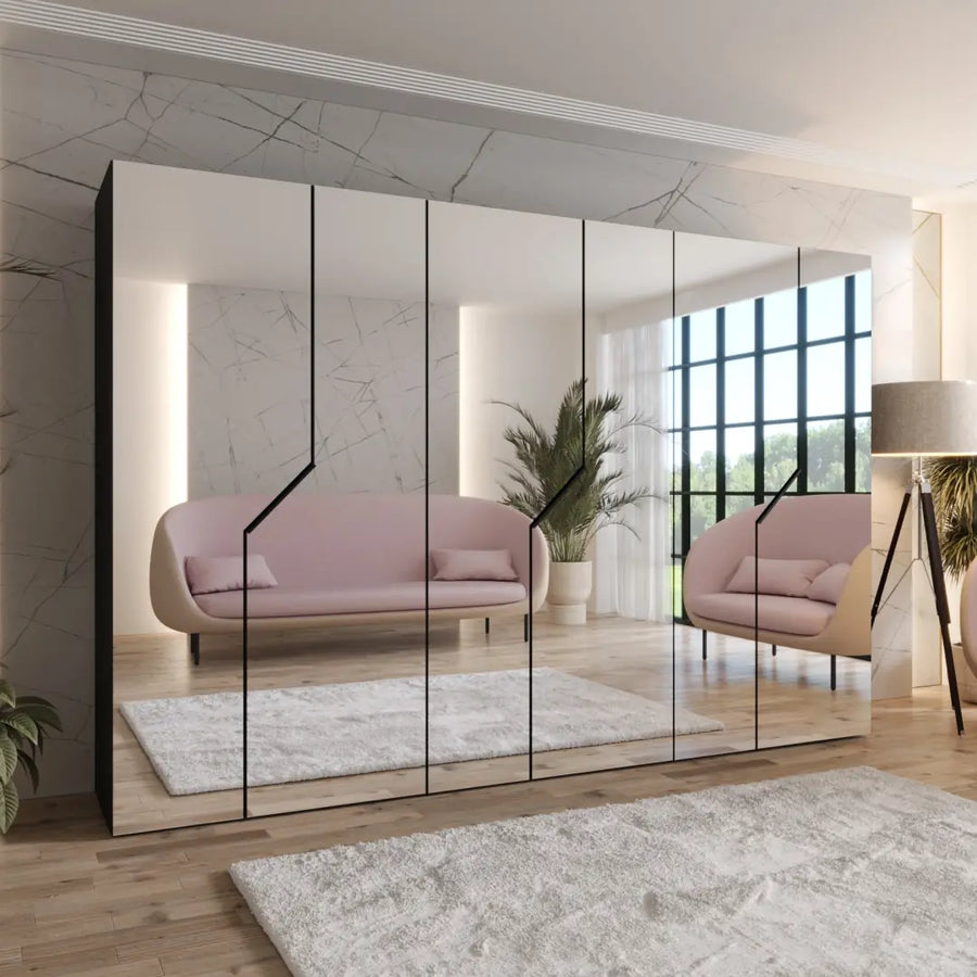 Blomvik III Hinged Door Wardrobe 300cm with mirrored doors reflecting a stylish room with sofas and a plant