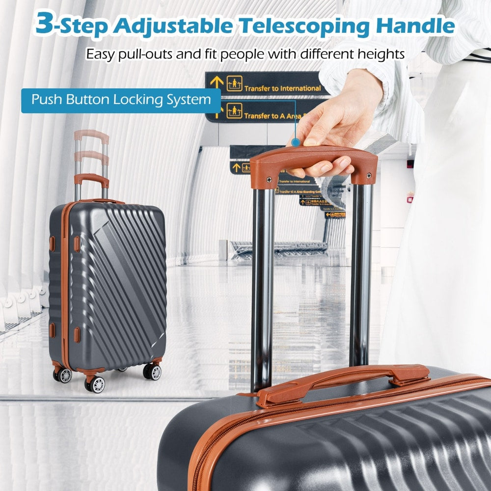 Close up of the telescoping handle and push button locking system on a grey camping suitcase