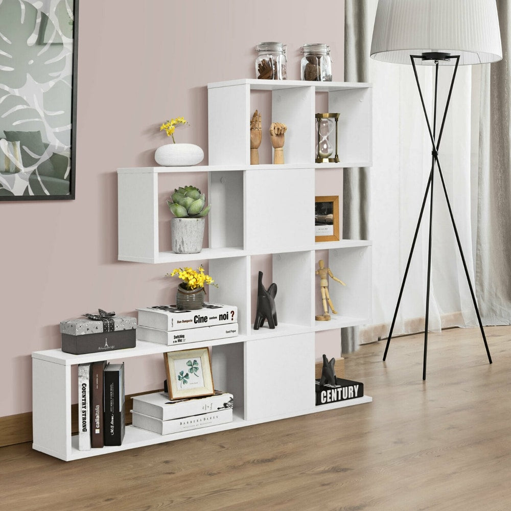 The white display and storage bookshelf shown in a room with decorative items and books