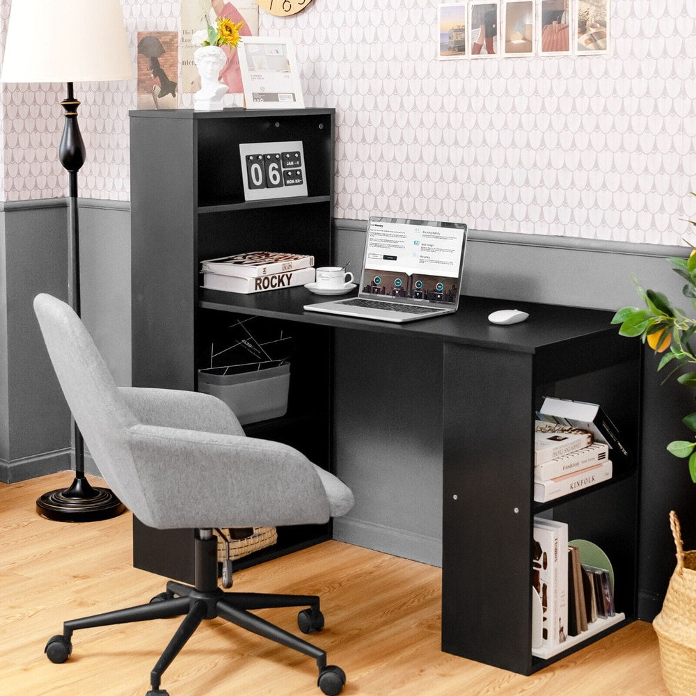 The office desk positioned in a corner with a grey chair and a lamp nearby