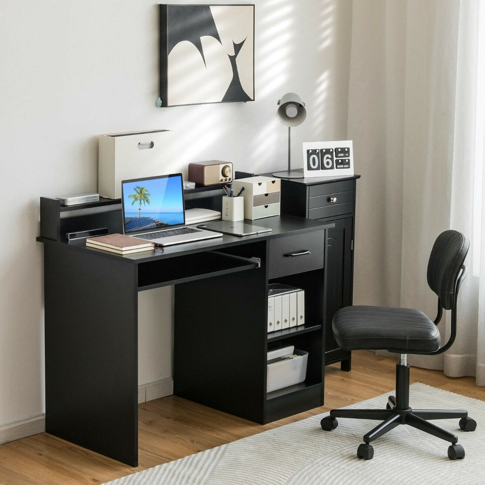 The black office desk is set up in a study room with a laptop and chair