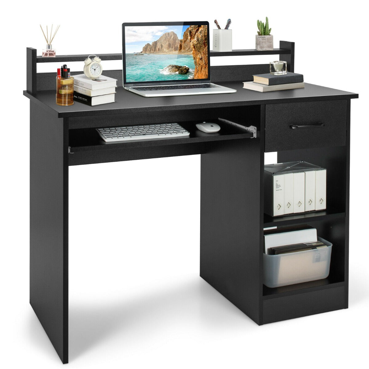 A black wooden computer desk with a keyboard tray and shelves, styled with a laptop and books