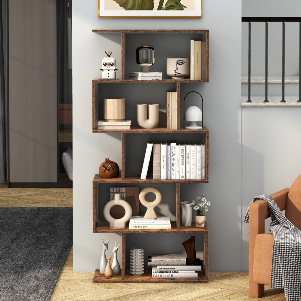 The S-shaped bookcase styled in a living room with books and decorative items