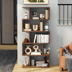 The S-shaped bookcase styled in a living room with books and decorative items