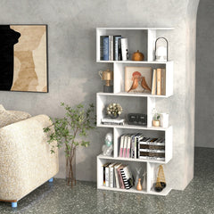 The white shelving unit in a modern home office, filled with books and decor