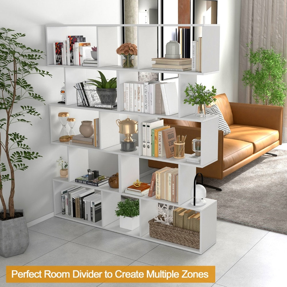 The white shelving unit used as a room divider, separating a living space