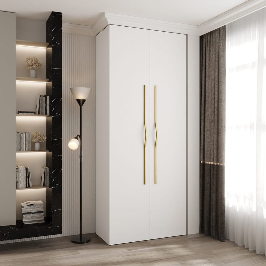 Como II Hinged Door Wardrobe 100cm with two white doors and gold handles in a modern room setting