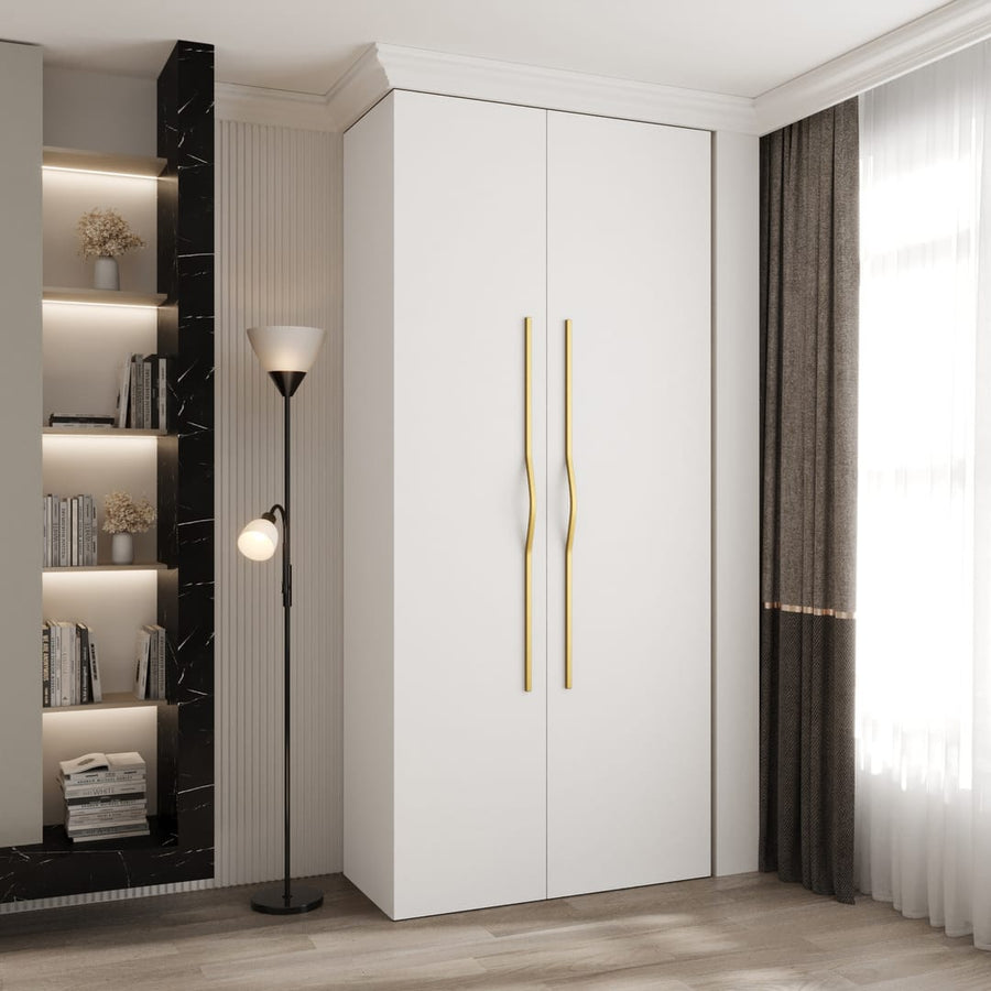 Como II Hinged Door Wardrobe 110cm in white standing in a modern bedroom with a floor lamp