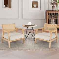 The accent chairs placed in a living room setting with a small round coffee table
