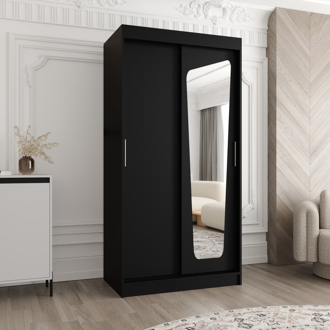 The black sliding door wardrobe with a mirrored door, shown in a bedroom setting
