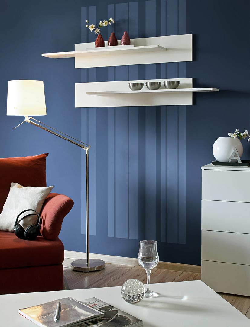 Fly Wall Shelf 100cm [Set Of Two] displayed on a blue wall above a red sofa and a white cabinet