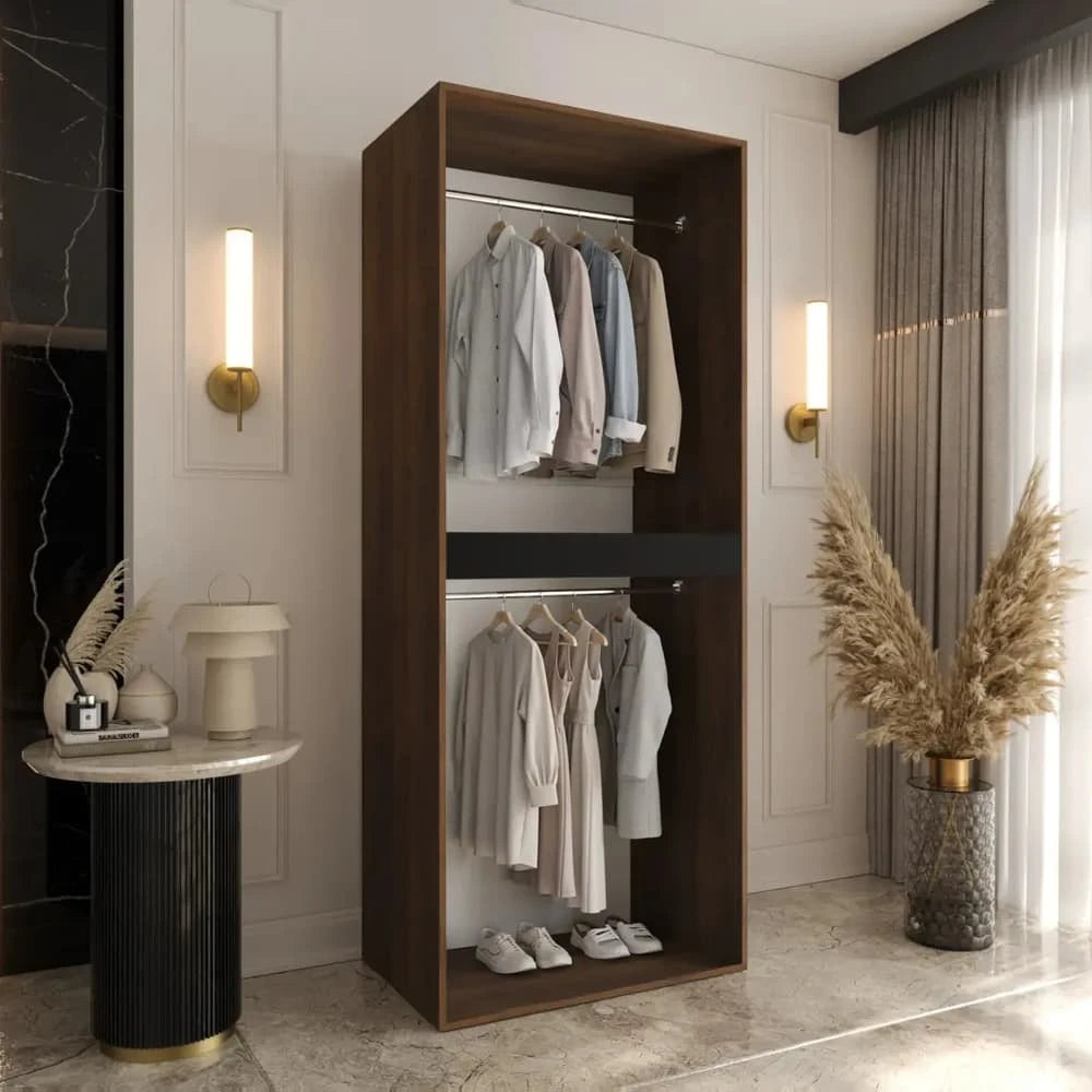 The dark wood hinged door wardrobe with clothes hanging on rails