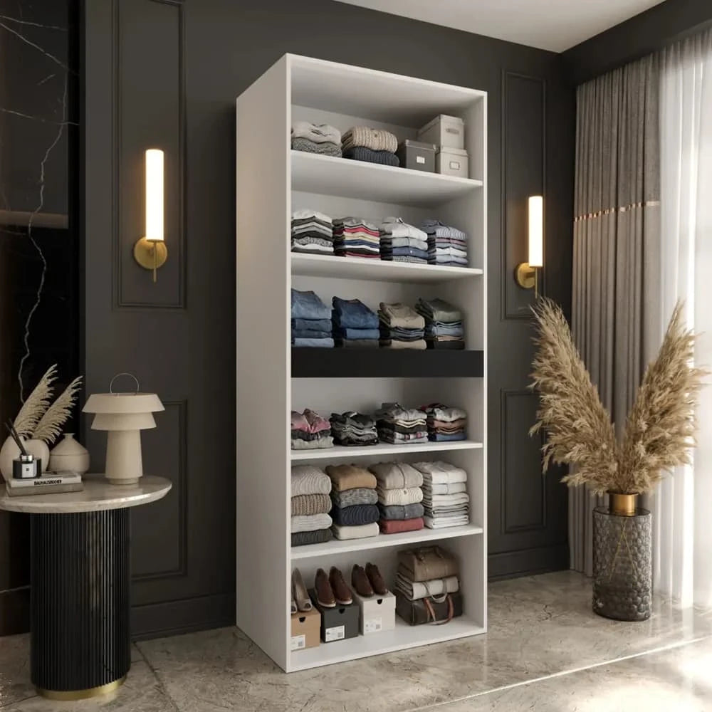 The hinged wardrobe interior with shelves full of folded clothes and shoes