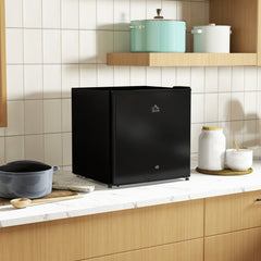 Black countertop fridge in a modern kitchen setting on a marble worktop