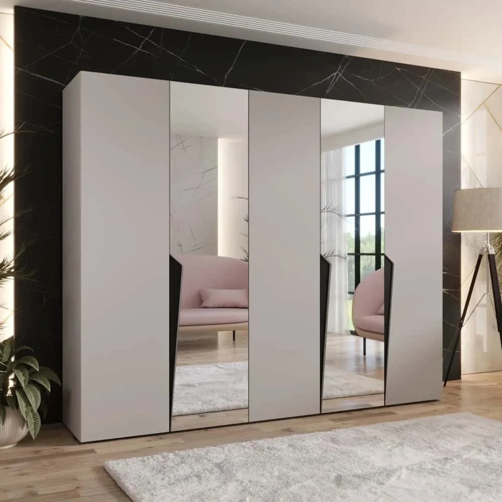A light grey hinged wardrobe with mirrored doors in a bright room