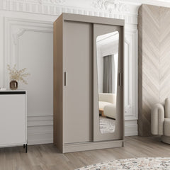 The plain grey sliding door wardrobe featuring a unique mirror shape in a bright interior