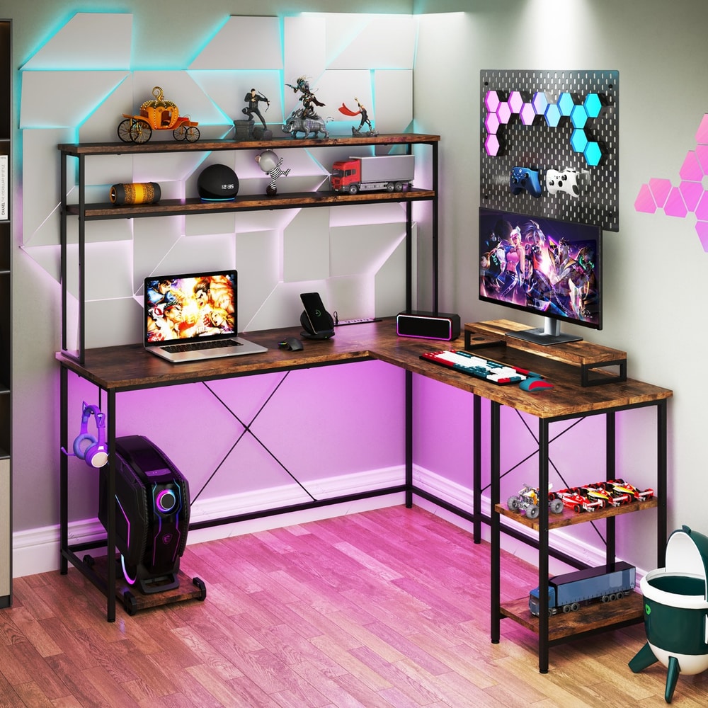 The office desk illuminated with colourful LED lights in a gaming room setup