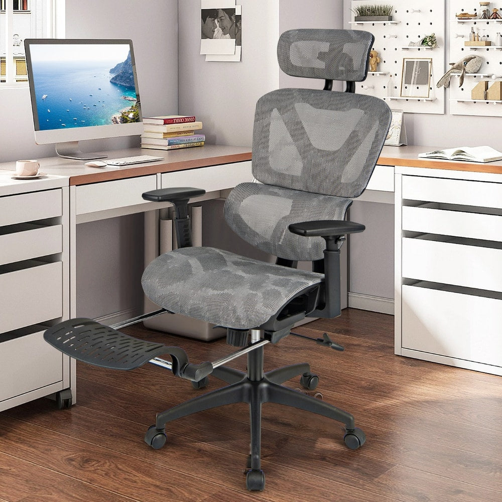 The office chair placed in a bright home study room next to a desk and computer monitor