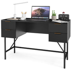 Black computer desk with storage, styled with a laptop, lamp, and decorative items