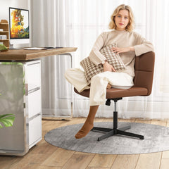 Woman sitting on the brown PU leather upholstered armless office desk chair at a desk