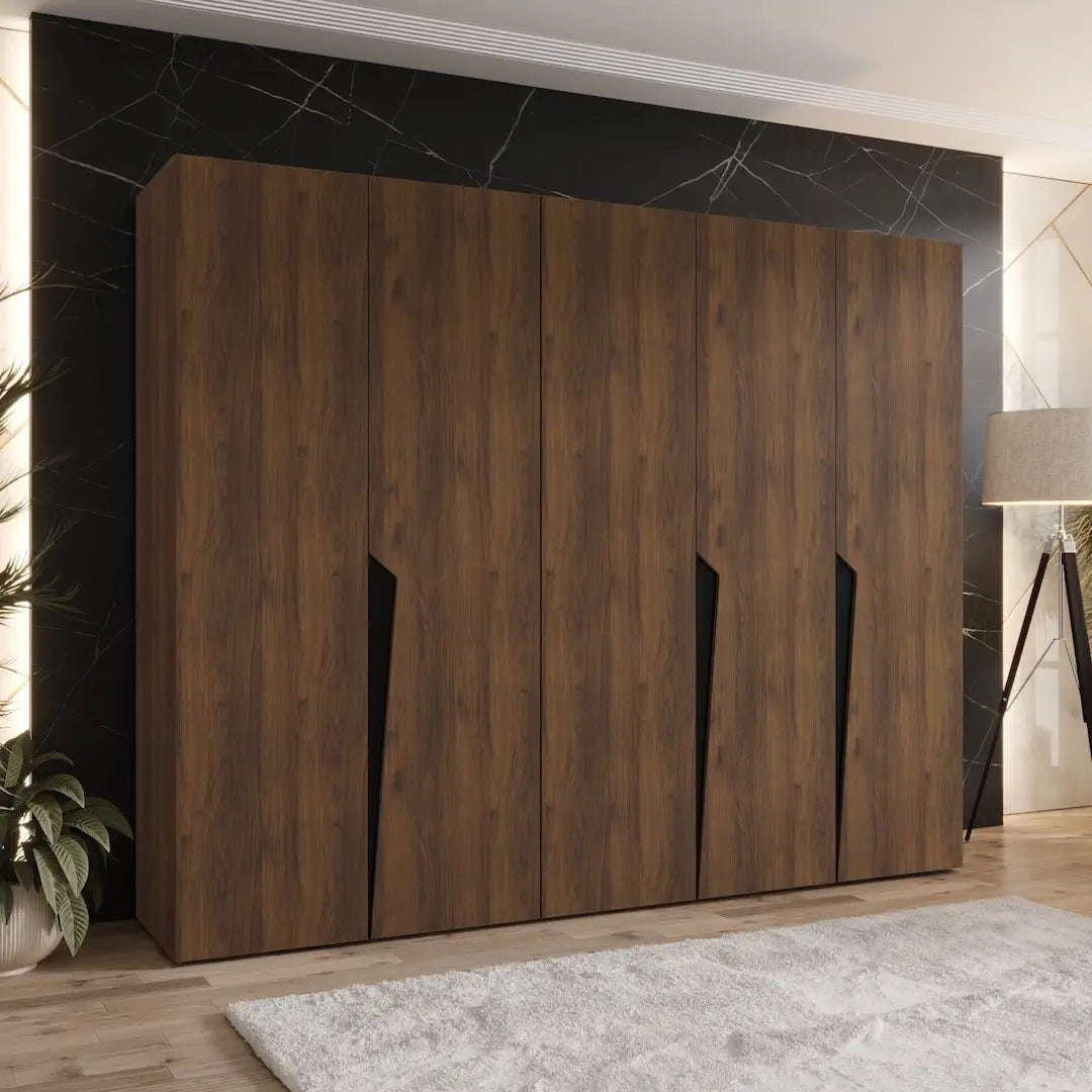 The hinged wardrobe in a dark wood grain finish positioned in a modern room setting