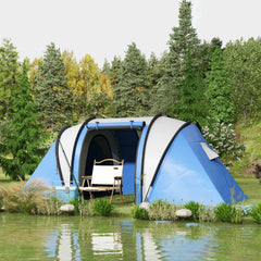 The blue camping tent set up by a lake with a chair and cooler beside it