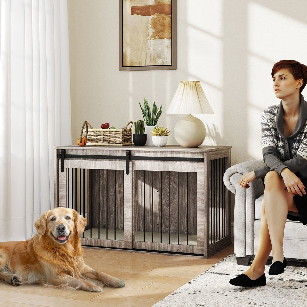 A large golden retriever dog lies on a wooden floor next to the dog crate furniture in a living room