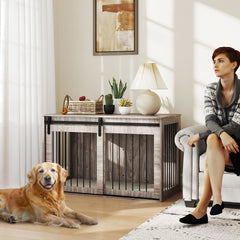 A large golden retriever dog lies on a wooden floor next to the dog crate furniture in a living room
