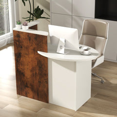 The reception desk in an office with a computer and chair, showing the curved front