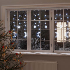 Star and Moon Fairy Lights Remote Control 345 LED Cold displayed hanging in a window at night