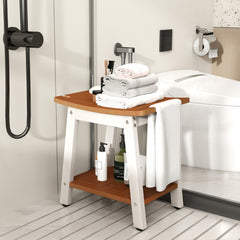 The shower stool placed in a modern bathroom with folded towels and toiletries on the shelf