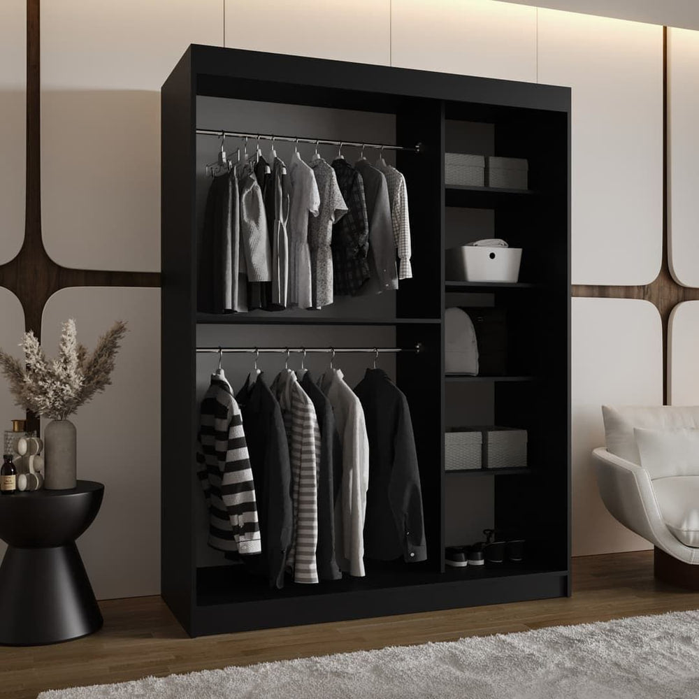 The open sliding door wardrobe showing hanging rails and shelves