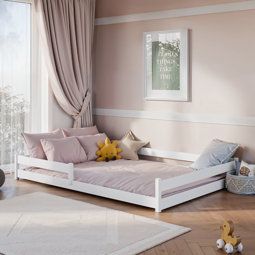 Wooden Bed Fini [EU Double] in white shown in a bright bedroom with pink bedding and cushions