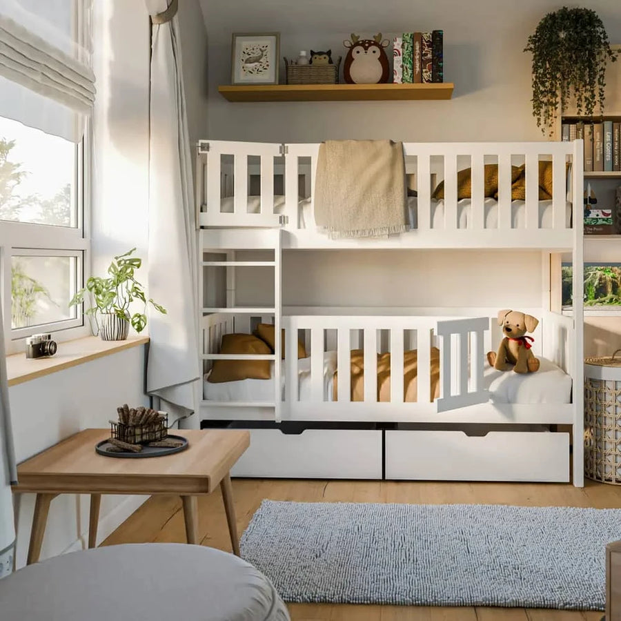 Wooden Bunk Bed Ksawery With Drawers in a bright bedroom with bedding and toys