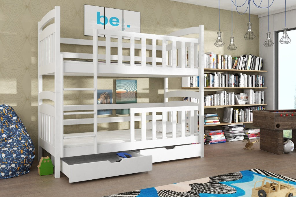 The white bunk bed positioned in a playroom with a drawer extended and a bookshelf nearby